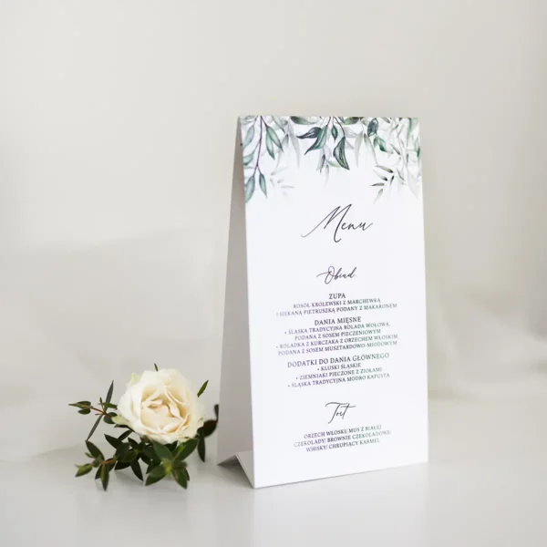 Eleganckie menu weselne w stylu botanicznym z zielonym motywem liści.