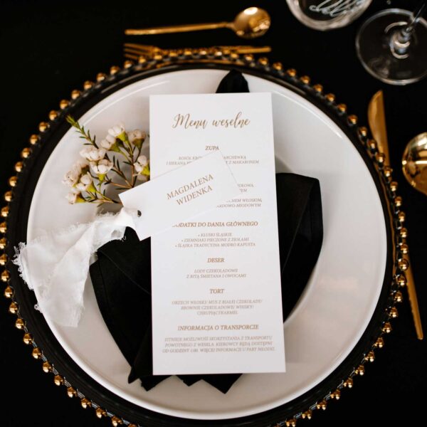Proste menu weselne ze złotymi napisami.