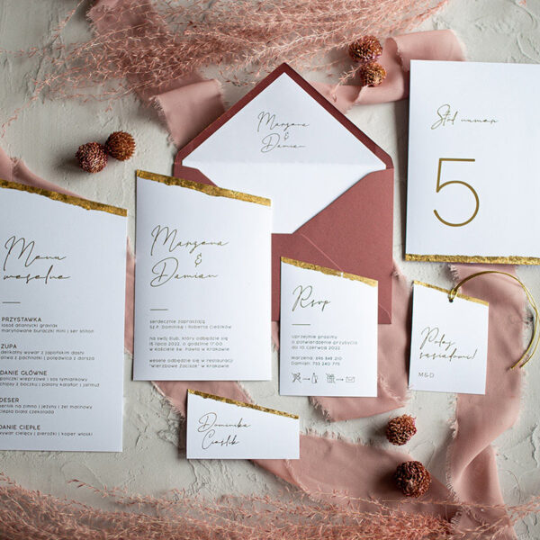 Ozdobna papeteria weselna z ręcznym złoceniem.