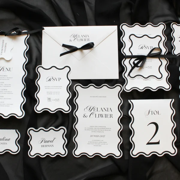 Czarna kolekcja ślubna Modern Wave – eleganckie karty z falowanymi krawędziami i czarnymi dodatkami.