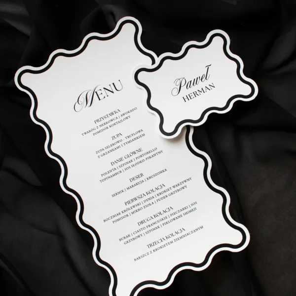 Czarne menu Modern Wave z falowaną ramką i winietką ułożoną obok, na czarnym tle.