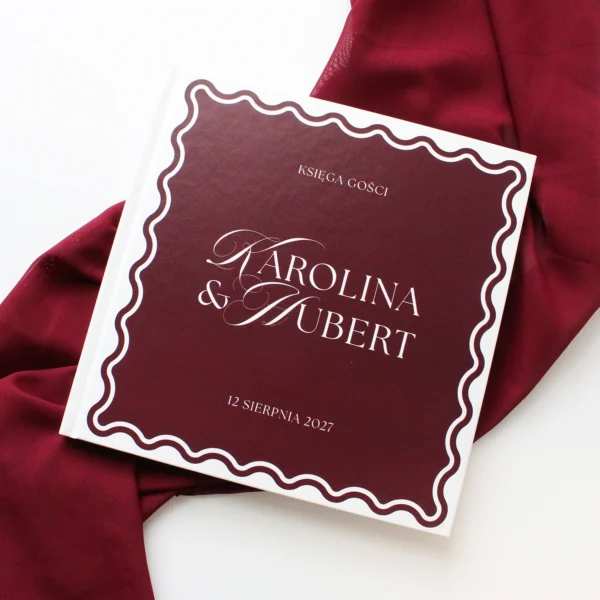 księga gości Wave Classic w kolorze burgundowym na tle eleganckiej tkaniny