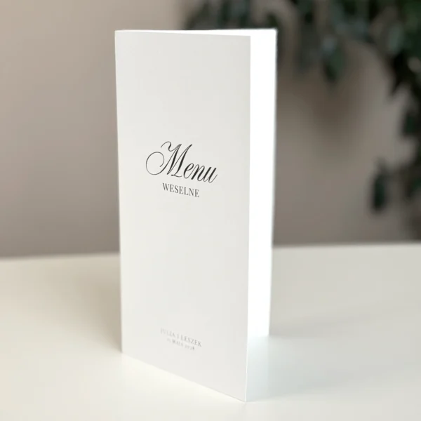Otwierane menu z harmonogramem wesela na śmietankowym papierze z eleganckim czarnym drukiem.
